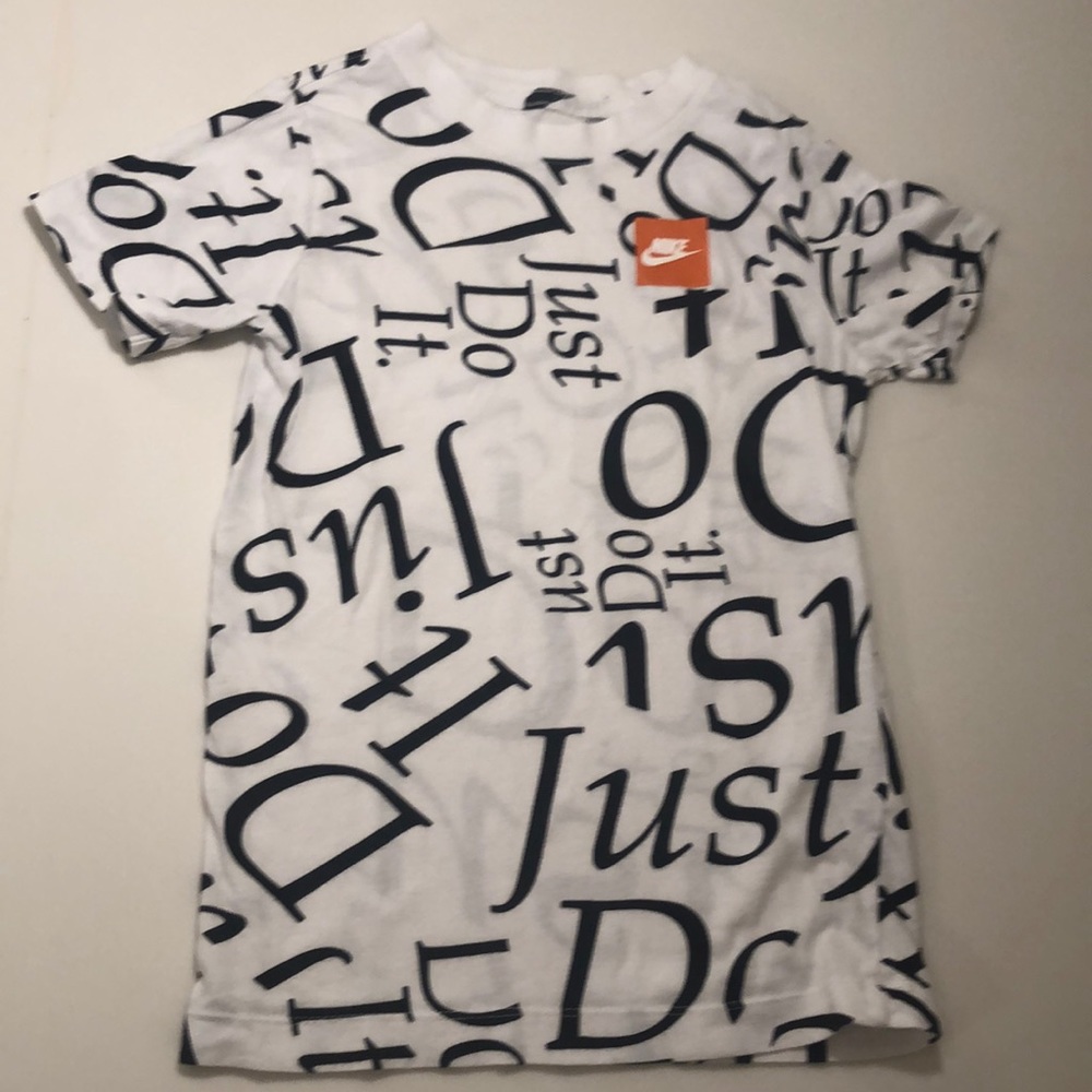 White Nike tee with words all over